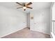 A bright bedroom featuring carpet floors, ample space, and closet access at 821 Twickenham Loop, Longs, SC 29568