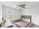 This bright bedroom offers lots of natural light and carpet flooring at 821 Twickenham Loop, Longs, SC 29568