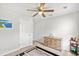 Bedroom featuring a ceiling fan, carpet flooring, a window, and closet access at 821 Twickenham Loop, Longs, SC 29568