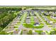Expansive aerial view of a residential community with well-maintained lawns and tree-lined streets at 821 Twickenham Loop, Longs, SC 29568