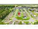 Expansive aerial view of a residential community with well-maintained lawns and tree-lined streets at 821 Twickenham Loop, Longs, SC 29568