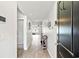 Inviting hallway with wood flooring and light walls leading to the living area at 821 Twickenham Loop, Longs, SC 29568