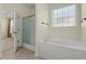 Bright bathroom featuring a large soaking tub and separate shower at 8708 Coosaw Ct., Myrtle Beach, SC 29577