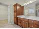 Bathroom featuring a large vanity with a double sink, storage, and a linen closet at 8708 Coosaw Ct., Myrtle Beach, SC 29577