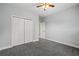 This bedroom features a ceiling fan and closet for storage at 8708 Coosaw Ct., Myrtle Beach, SC 29577