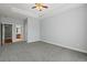 This bedroom features a tray ceiling with carpet flooring at 8708 Coosaw Ct., Myrtle Beach, SC 29577