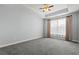 Empty bedroom with neutral carpet, a window, and light blue walls at 8708 Coosaw Ct., Myrtle Beach, SC 29577