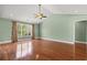 Bright bedroom featuring hardwood floors, large windows, and a comfortable, inviting atmosphere at 8708 Coosaw Ct., Myrtle Beach, SC 29577
