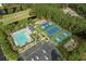 Aerial view of community amenities, including a pool, tennis courts, playground, and parking area at 8708 Coosaw Ct., Myrtle Beach, SC 29577