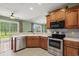 Updated kitchen featuring stainless steel appliances, granite countertops and tile floors at 8708 Coosaw Ct., Myrtle Beach, SC 29577