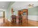 Kitchen view with breakfast bar seating, wood cabinetry, stainless steel refrigerator, and hardwood floors at 8708 Coosaw Ct., Myrtle Beach, SC 29577