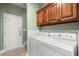 This laundry room features wooden cabinets at 8708 Coosaw Ct., Myrtle Beach, SC 29577