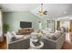 Inviting living room showcasing stylish furniture, hardwood floors, and an open layout connecting to other spaces at 8708 Coosaw Ct., Myrtle Beach, SC 29577