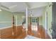 Spacious living room with hardwood floors, bright windows, and a modern, open floor plan at 8708 Coosaw Ct., Myrtle Beach, SC 29577