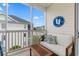 Relaxing screened-in balcony offering views of the community pool and outdoor lounging area at 901 W Port Dr. # 2114, North Myrtle Beach, SC 29582