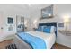 Charming bedroom showcasing a neatly made bed, tasteful decorations, and a mirrored closet at 901 W Port Dr. # 2114, North Myrtle Beach, SC 29582
