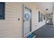 Exterior condo entrance with a decorative wreath on the door and neatly painted trim at 901 W Port Dr. # 2114, North Myrtle Beach, SC 29582
