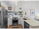 Well-equipped kitchen with stainless steel appliances, ample counter space, and modern fixtures at 901 W Port Dr. # 2114, North Myrtle Beach, SC 29582