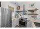 Bright kitchen featuring stainless steel appliances, modern fixtures, and plenty of counter space at 901 W Port Dr. # 2114, North Myrtle Beach, SC 29582