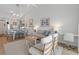 Bright living room with vaulted ceilings, modern decor, and an open layout to the kitchen and dining area at 901 W Port Dr. # 2114, North Myrtle Beach, SC 29582