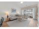 Bright living room with stylish furniture, a cozy sofa, and access to an outdoor balcony at 901 W Port Dr. # 2114, North Myrtle Beach, SC 29582