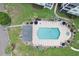 Aerial view highlighting the community pool with spa and palm tree accents at 901 W Port Dr. # 2114, North Myrtle Beach, SC 29582