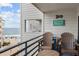 Inviting balcony with beach chairs, table, and ocean views creating a relaxing outdoor space at 920 N Waccamaw Dr. # 2310, Murrells Inlet, SC 29576