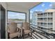Balcony view with chairs overlooking the complex and neighborhood at 920 N Waccamaw Dr. # 2310, Murrells Inlet, SC 29576