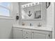 Bathroom with double sinks, decorative mirror, and an anchor decoration at 920 N Waccamaw Dr. # 2310, Murrells Inlet, SC 29576