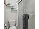 Cozy bathroom features a shower, toilet, and decorative shelving for storage at 920 N Waccamaw Dr. # 2310, Murrells Inlet, SC 29576