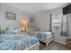 Cozy bedroom featuring two twin beds with matching coastal-themed bedding at 920 N Waccamaw Dr. # 2310, Murrells Inlet, SC 29576