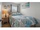 Bedroom featuring nautical decor, a side table, and a window at 920 N Waccamaw Dr. # 2310, Murrells Inlet, SC 29576