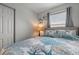 Comfortable bedroom with a coastal-themed bedding and a window at 920 N Waccamaw Dr. # 2310, Murrells Inlet, SC 29576