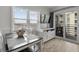 Bright dining area with a table, seating, and a balcony overlooking outdoor scenery at 920 N Waccamaw Dr. # 2310, Murrells Inlet, SC 29576
