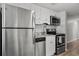 Modern kitchen with stainless steel appliances, white cabinets, and a stylish backsplash at 920 N Waccamaw Dr. # 2310, Murrells Inlet, SC 29576
