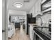 Modern kitchen with stainless steel appliances and a view into the living area at 920 N Waccamaw Dr. # 2310, Murrells Inlet, SC 29576