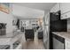 Bright kitchen with stainless steel appliances that opens to the living room at 920 N Waccamaw Dr. # 2310, Murrells Inlet, SC 29576
