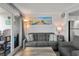 Comfortable living room with balcony, offering a cozy sofa and coastal-themed decor at 920 N Waccamaw Dr. # 2310, Murrells Inlet, SC 29576