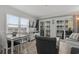 Bright living area with large windows and sliding doors to an outdoor space at 920 N Waccamaw Dr. # 2310, Murrells Inlet, SC 29576