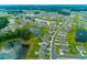An aerial view showcases the community's layout, featuring houses surrounding ponds and manicured green spaces at 964 Irving Dr., Little River, SC 29566