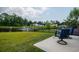 Backyard featuring green grass, pond view and outdoor patio furniture at 964 Irving Dr., Little River, SC 29566