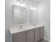 Bathroom vanity with double sinks, white countertop, and framed mirrors at 964 Irving Dr., Little River, SC 29566