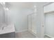 Bathroom features a tiled floor, glass door shower and closet with storage at 964 Irving Dr., Little River, SC 29566
