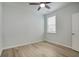 Bedroom with ceiling fan, hardwood floors, and window overlooking outside at 964 Irving Dr., Little River, SC 29566