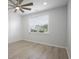 Bedroom with a large window, ceiling fan, and ample natural light at 964 Irving Dr., Little River, SC 29566