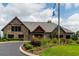 A community clubhouse with stone accents and manicured landscaping, offering a welcoming and sophisticated ambiance at 964 Irving Dr., Little River, SC 29566