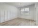 Bright dining room with wood-look floors, chandelier, paneled wall, and slider to the outdoor area at 964 Irving Dr., Little River, SC 29566