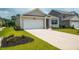 Well-maintained one story home featuring a driveway, a one car garage, and manicured lawn at 964 Irving Dr., Little River, SC 29566