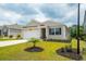 Charming single-story home with manicured lawn, neutral siding, and attached one car garage at 964 Irving Dr., Little River, SC 29566