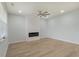 Spacious living room with hardwood floors, recessed lighting, and modern fireplace at 964 Irving Dr., Little River, SC 29566